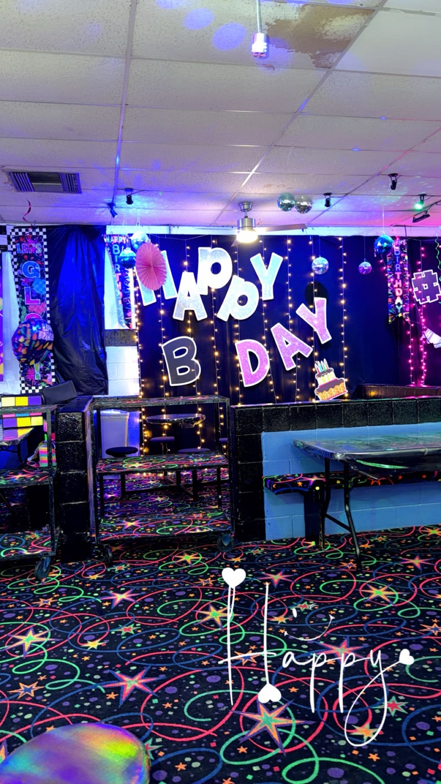 Glow Birthday area with Happy Birthday backdrop